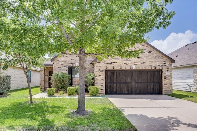 14605 Naruna Way, Pflugerville, TX 78660 - view of front of property featuring brick siding, driveway, a front lawn, and a garage