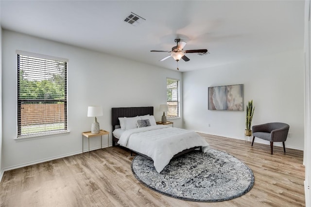 14605 Naruna Way, Pflugerville, TX 78660 - bedroom featuring light wood-style floors, baseboards, and ceiling fan