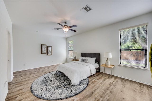 14605 Naruna Way, Pflugerville, TX 78660 - bedroom with light wood-style floors, baseboards, and a ceiling fan
