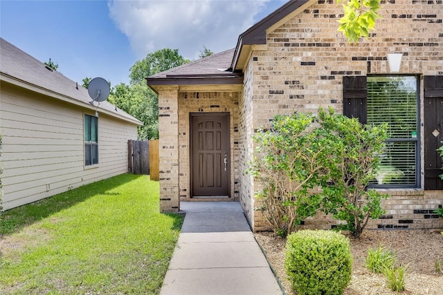 14605 Naruna Way, Pflugerville, TX 78660 - property entrance with a yard and brick siding