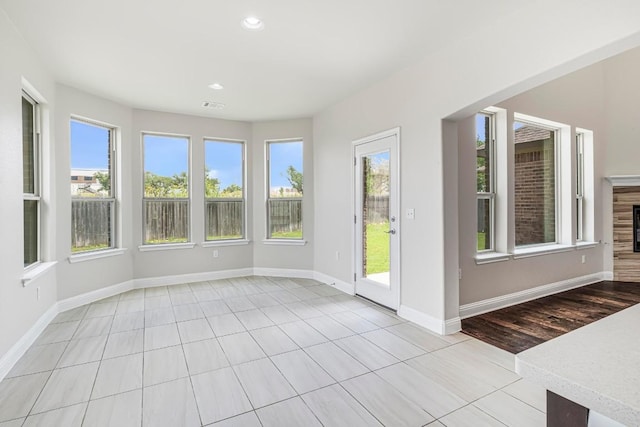 505 Fair Oaks Dr, Georgetown, TX 78628 - unfurnished sunroom featuring healthy amount of natural light, recessed lighting, baseboards, and tile patterned flooring