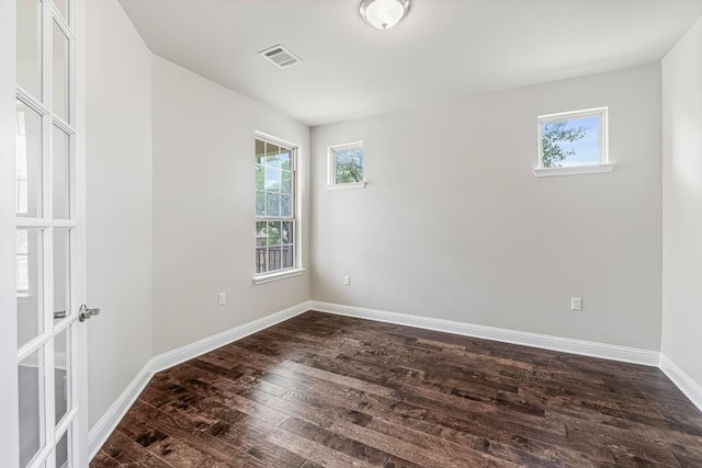 505 Fair Oaks Dr, Georgetown, TX 78628 - unfurnished room featuring plenty of natural light, dark wood finished floors, and baseboards