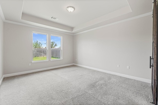 505 Fair Oaks Dr, Georgetown, TX 78628 - carpeted empty room with a raised ceiling, baseboards, and ornamental molding