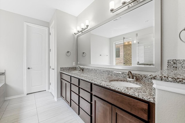 505 Fair Oaks Dr, Georgetown, TX 78628 - full bathroom with double vanity, an enclosed shower, tile patterned floors, and baseboards