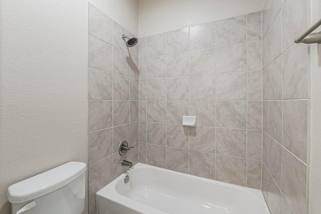 505 Fair Oaks Dr, Georgetown, TX 78628 - full bathroom with toilet, bathtub / shower combination, and a textured wall