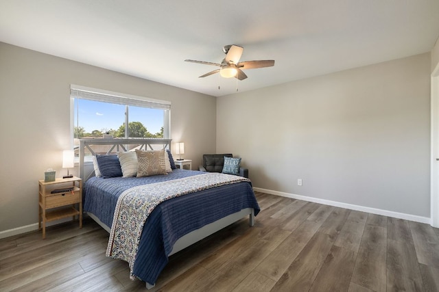 515 Circle Dr, Sunrise Beach, TX 78643 - bedroom with wood finished floors, baseboards, and a ceiling fan