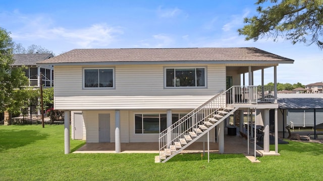 515 Circle Dr, Sunrise Beach, TX 78643 - rear view of property featuring a patio area, a yard, stairway, and roof with shingles