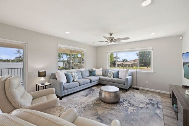 515 Circle Dr, Sunrise Beach, TX 78643 - living room with light wood-type flooring, recessed lighting, a ceiling fan, and baseboards