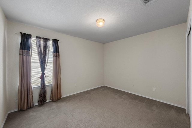3807 Haleys Way, Round Rock, TX 78665 - carpeted empty room featuring baseboards and a textured ceiling