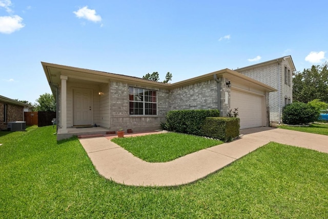 3807 Haleys Way, Round Rock, TX 78665 - view of front facade with driveway, a garage, a front lawn, and cooling unit