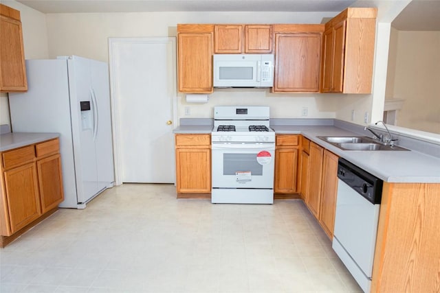 3807 Haleys Way, Round Rock, TX 78665 - kitchen with white appliances, light countertops, a peninsula, and light flooring
