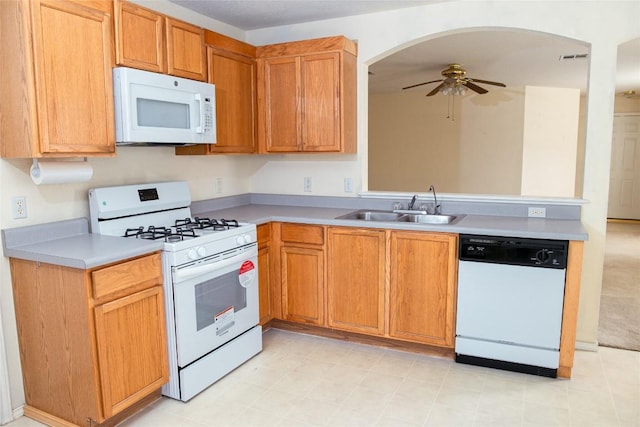 3807 Haleys Way, Round Rock, TX 78665 - kitchen featuring white appliances, ceiling fan, arched walkways, light countertops, and a peninsula