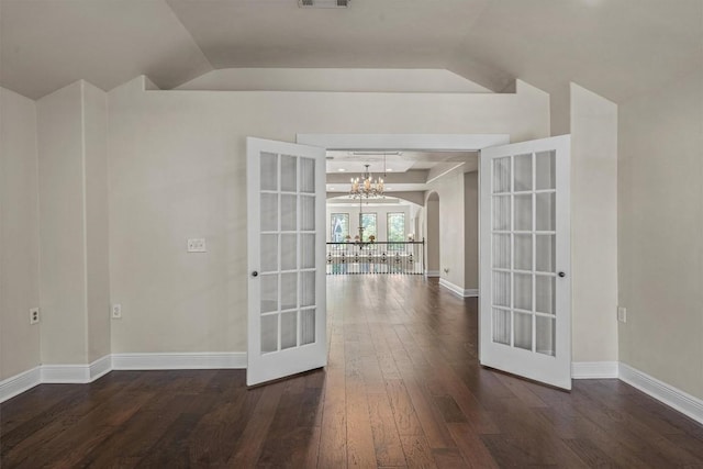 800 Canyon Bend Rd, Pflugerville, TX 78660 - spare room featuring french doors, dark wood-style flooring, vaulted ceiling, a chandelier, and baseboards