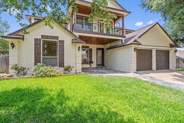 800 Canyon Bend Rd, Pflugerville, TX 78660 - view of front facade featuring a balcony, brick siding, driveway, and an attached garage