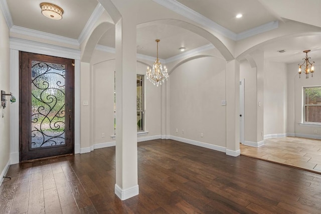 800 Canyon Bend Rd, Pflugerville, TX 78660 - foyer with a chandelier, hardwood / wood-style flooring, arched walkways, crown molding, and baseboards