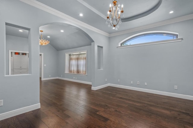 800 Canyon Bend Rd, Pflugerville, TX 78660 - spare room featuring a chandelier, dark wood finished floors, arched walkways, baseboards, and recessed lighting