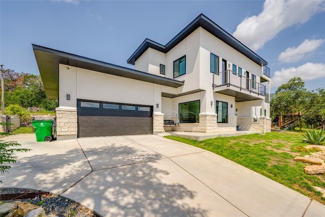 13209 Mansfield Dr, Austin, TX 78732 - view of front facade with stone siding, stucco siding, a balcony, and concrete driveway