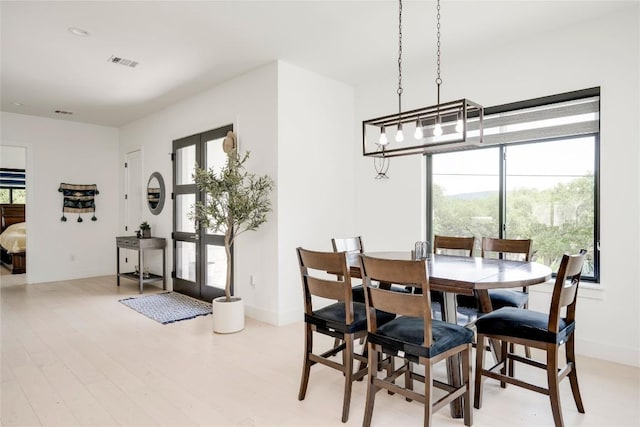 13209 Mansfield Dr, Austin, TX 78732 - dining room with light wood finished floors