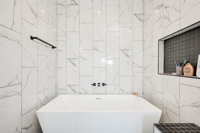 13209 Mansfield Dr, Austin, TX 78732 - bathroom featuring a freestanding tub and tile walls