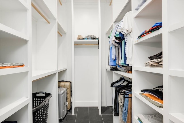 13209 Mansfield Dr, Austin, TX 78732 - walk in closet featuring dark tile patterned flooring