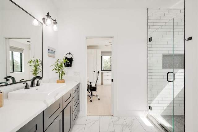13209 Mansfield Dr, Austin, TX 78732 - bathroom with vanity, a shower stall, healthy amount of natural light, and marble look tiles