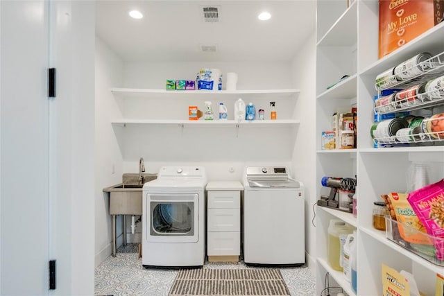 13209 Mansfield Dr, Austin, TX 78732 - laundry room featuring washer and dryer, recessed lighting, and light tile patterned flooring