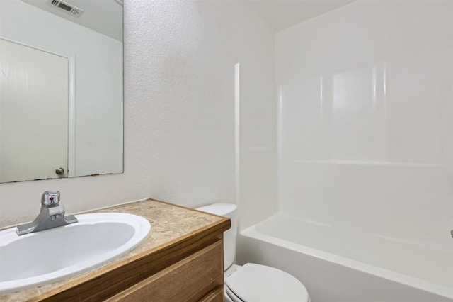 224 Copper Ln, Jarrell, TX 76537 - full bathroom featuring toilet, vanity, and  shower combination