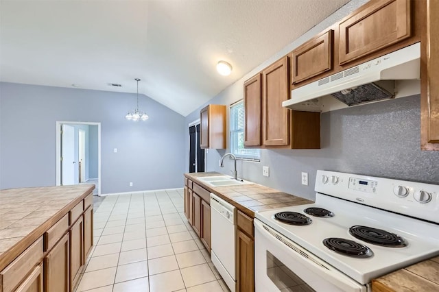 224 Copper Ln, Jarrell, TX 76537 - kitchen featuring white appliances, tile countertops, under cabinet range hood, a sink, and vaulted ceiling