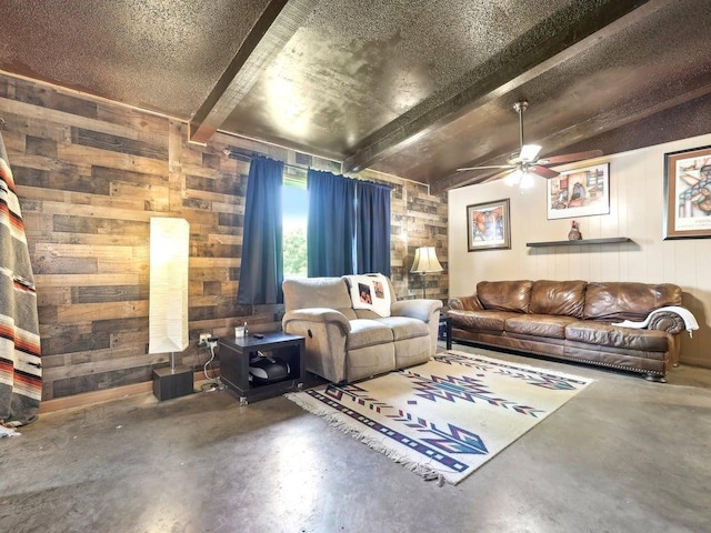 8622 Thunderbird Rd, Austin, TX 78736 - living area featuring concrete floors, wood walls, ceiling fan, and beam ceiling