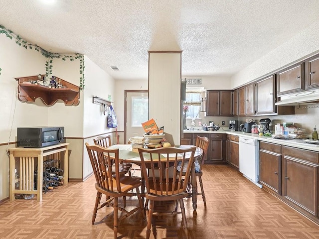 8622 Thunderbird Rd, Austin, TX 78736 - dining room with a textured ceiling