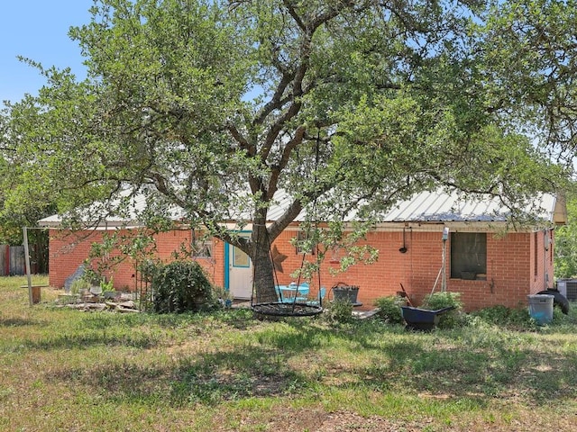 8622 Thunderbird Rd, Austin, TX 78736 - rear view of property featuring brick siding