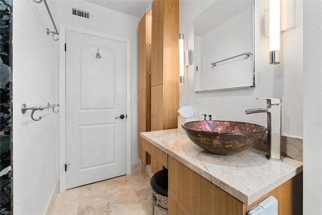 2301 Del Curto Rd, Austin, TX 78704 - bathroom featuring vanity and baseboards