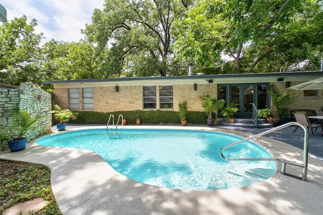 2301 Del Curto Rd, Austin, TX 78704 - outdoor pool with french doors and a patio area