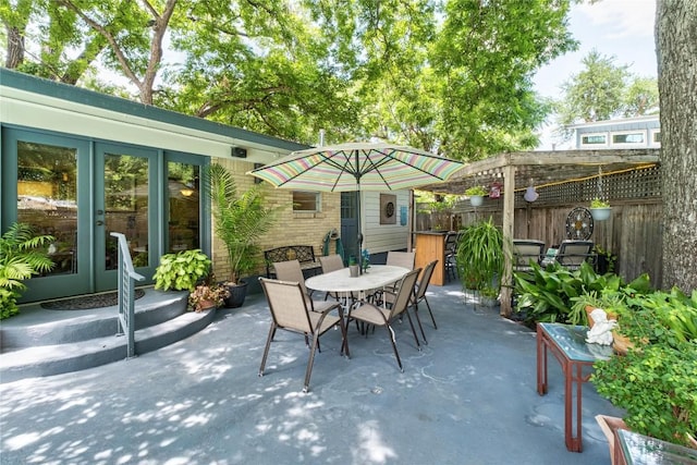 2301 Del Curto Rd, Austin, TX 78704 - fenced backyard featuring a patio area and outdoor dining area