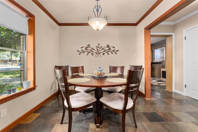 2301 Del Curto Rd, Austin, TX 78704 - dining area with stone tile flooring, baseboards, and ornamental molding