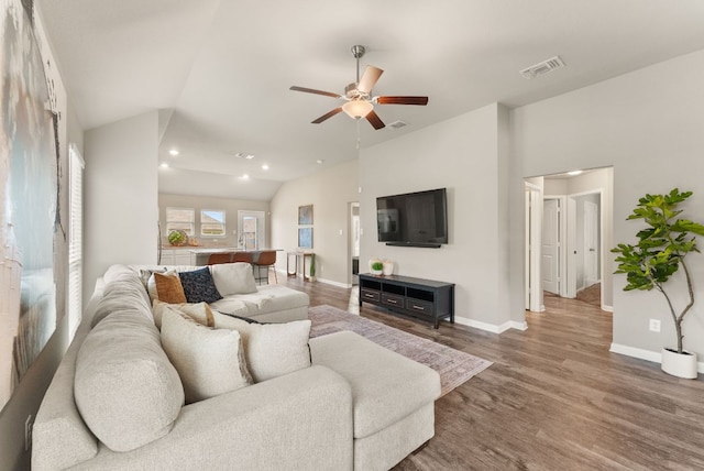 1910 Lummus Dr, Temple, TX 76504 - living area featuring wood finished floors, baseboards, ceiling fan, recessed lighting, and lofted ceiling