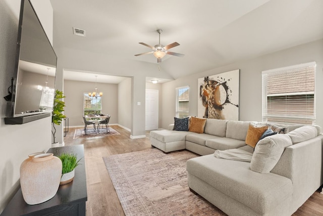 1910 Lummus Dr, Temple, TX 76504 - living area featuring light wood-style floors, plenty of natural light, a ceiling fan, and vaulted ceiling