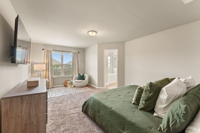 1910 Lummus Dr, Temple, TX 76504 - bedroom featuring light colored carpet, ensuite bathroom, and baseboards