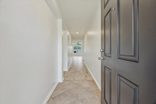 110 Rinehardt St, Hutto, TX 78634 - corridor with baseboards, light tile patterned floors, and recessed lighting