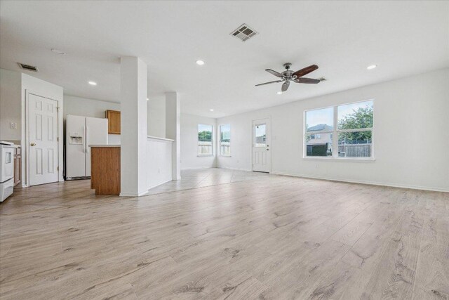 110 Rinehardt St, Hutto, TX 78634 - unfurnished living room with recessed lighting, light wood finished floors, ceiling fan, and baseboards