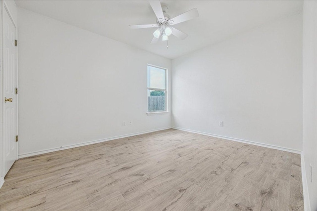 110 Rinehardt St, Hutto, TX 78634 - spare room featuring wood finished floors, baseboards, and a ceiling fan