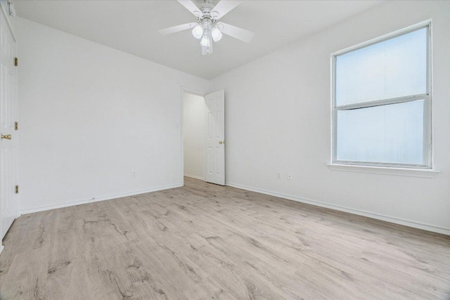 110 Rinehardt St, Hutto, TX 78634 - spare room featuring wood finished floors, baseboards, and a ceiling fan