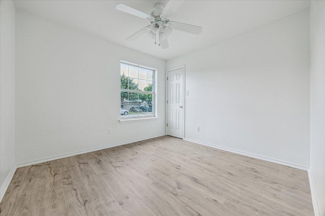 110 Rinehardt St, Hutto, TX 78634 - spare room featuring wood finished floors, baseboards, and ceiling fan