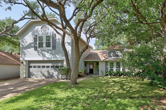 13210 Dime Box Trl, Austin, TX 78729 - view of front of home with concrete driveway, an attached garage, a front lawn, and stone siding