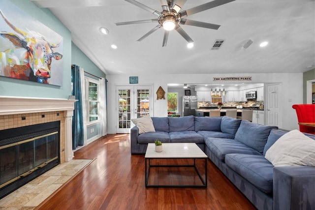 13210 Dime Box Trl, Austin, TX 78729 - living area with wood finished floors, a fireplace, a ceiling fan, recessed lighting, and french doors