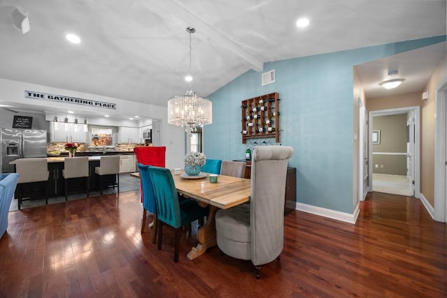 13210 Dime Box Trl, Austin, TX 78729 - dining area with dark wood finished floors, a chandelier, baseboards, and recessed lighting