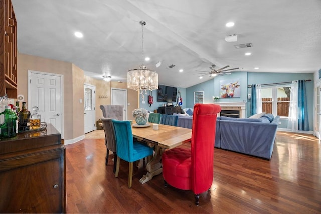 13210 Dime Box Trl, Austin, TX 78729 - dining room with wood finished floors, a chandelier, a ceiling fan, lofted ceiling, and baseboards