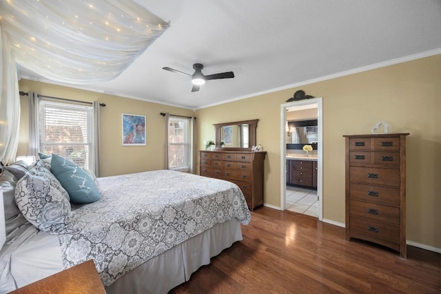 13210 Dime Box Trl, Austin, TX 78729 - bedroom with ornamental molding, multiple windows, wood finished floors, baseboards, and ceiling fan