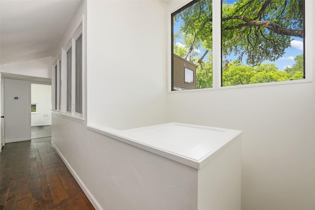 5902 Tumbling Cir, Austin, TX 78731 - hallway featuring healthy amount of natural light, wood-type flooring, and baseboards