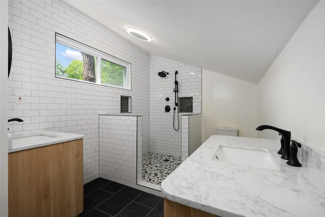 5902 Tumbling Cir, Austin, TX 78731 - full bath featuring vanity, walk in shower, tile patterned floors, vaulted ceiling, and toilet